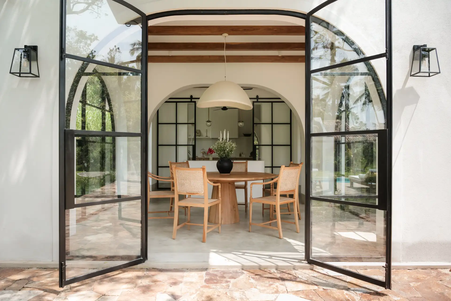 Dining area with Ceylon teak table and pool views